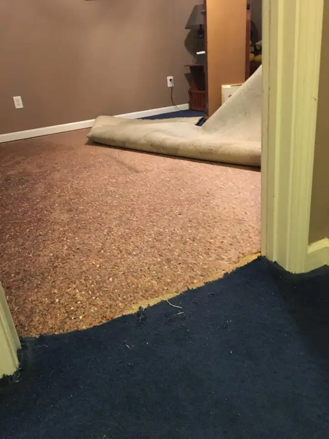Carpet pad removal revealing water damage during Water Mitigation Services in Valley